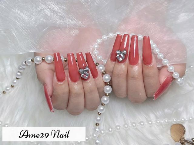 AME29 Nail コーラルレッドにリボンのビジュー